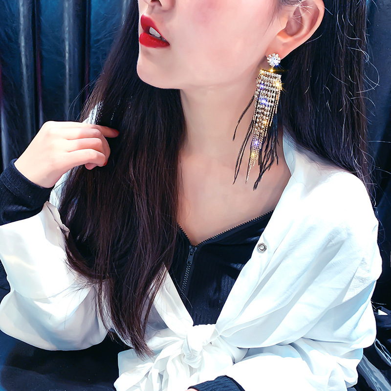 Boucles d'oreilles en plaqué or avec plumes – Image 5